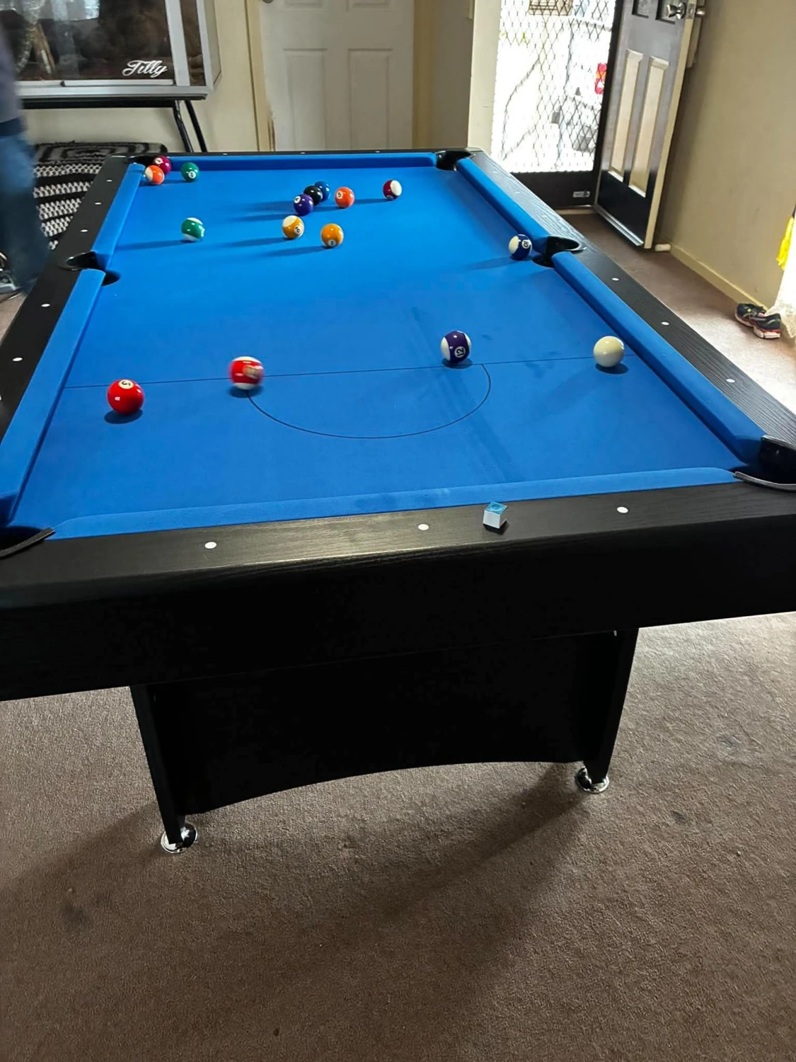 Blue pool table in a home